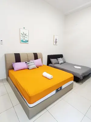 two beds in a room with yellow and purple at JOVIAL SingleStorey Bungalow 4Room10Pax `Alma in Bukit Mertajam