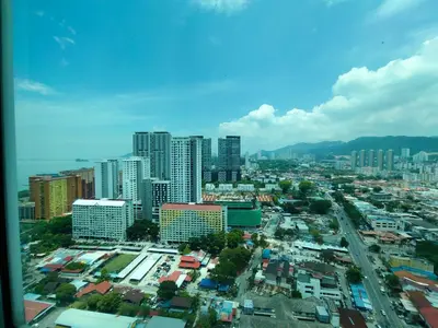 a view of a city with tall buildings at Strait Garden Family Suites by Maj in Jelutong