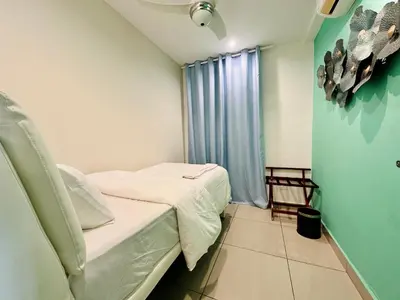 a small room with a bed and a window at The Majestic Ipoh Town - Mountain View in Ipoh