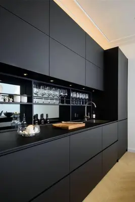 a black kitchen with a counter and a sink at Georgetown Luxury Heritage House 4BR 10Pax in George Town