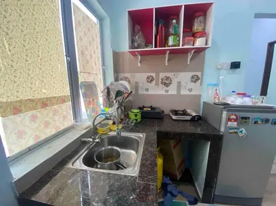 a small kitchen with a sink and a window at Homestay Naim Sabak Bernam in Sabak Bernam