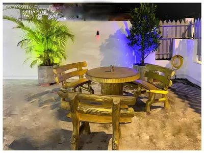 a wooden table and chairs and a table and chairs at ✩ 23 HOUSE ✩ 23号 复古老宅 ✩ Vintage Homestay in Butterworth