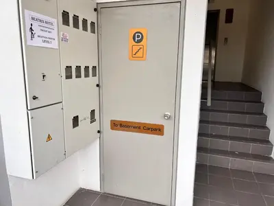 a row of lockers in a building with a sign on it at BEATRIX HOTEL in Brinchang