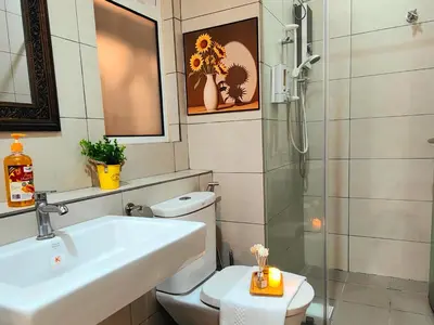 a bathroom with a toilet and a sink and a shower at Ipoh City Modern Homestay Octagon 5-6 pax Apartment Suite Free Parking by City Home Empire in Ipoh