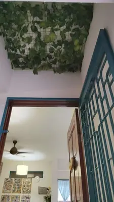 a room with a door and a ceiling at Comfy Home Near to Penang Hill in Ayer Itam