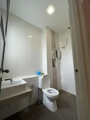 a bathroom with a white toilet and a sink at 4 Bedroom 4 PRIVATE BATHROOM 4B12B 5 min City Center in Ipoh