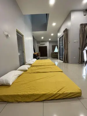 two beds with yellow covers in a room at 4 Bedroom 4 PRIVATE BATHROOM 4B12B 5 min City Center in Ipoh