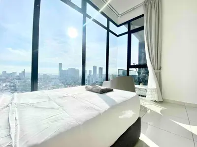 a white bed in a room with a large window at Beacon Executive Suites #Warmth suite #Rooftop pool #Georgetown in George Town