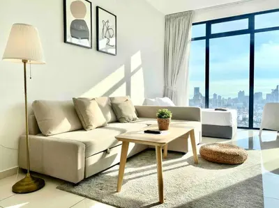 a living room with a couch and a table at Beacon Executive Suites #Warmth suite #Rooftop pool #Georgetown in George Town