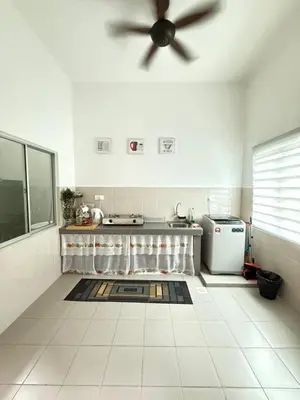 a kitchen with a ceiling fan in a room at QM_Homestay Bagan Serai in Bagan Serai