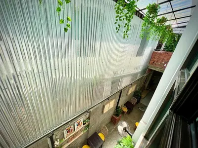 an overhead view of a building with a fence at DoSomething Guest House 8 in Ipoh