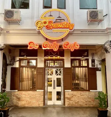 a restaurant with a sign that reads do only cafe at DoSomething Guest House 1 in Ipoh