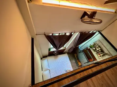 an overhead view of a bedroom with a window at DoSomething Guest House 2 in Ipoh