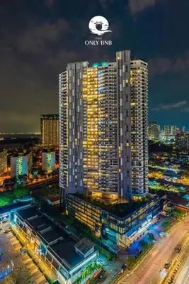 a tall building with a sign on top of it at Luxury Seaview Projector Lounge by The Only Bnb in Tanjong Tokong