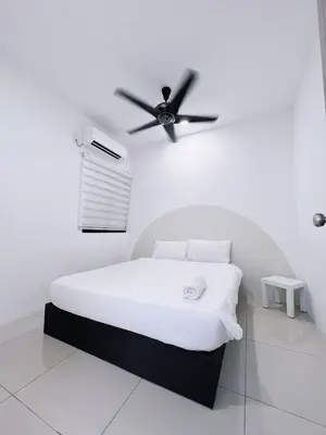 a white bedroom with a bed with a ceiling fan at Manhanttan Ipoh Waterpark Homestay By Warmth Stay 4-7pax 3BR in Ipoh