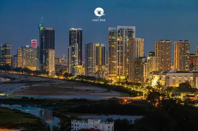 a view of a city at night with a city skyline at Family Seaview Suite with 3 Rooms by The Only Bnb in Tanjong Tokong