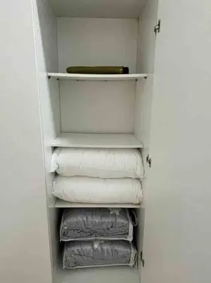 a closet with white towels and a bunch of towels at Biella Homestay Apartment for Muslim in Tanah Rata