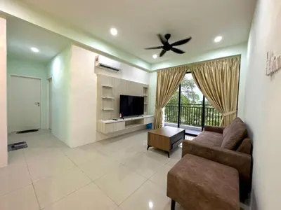 a living room with a couch and a ceiling fan at Ipoh Simple Homestay by Comfort Home in Ipoh
