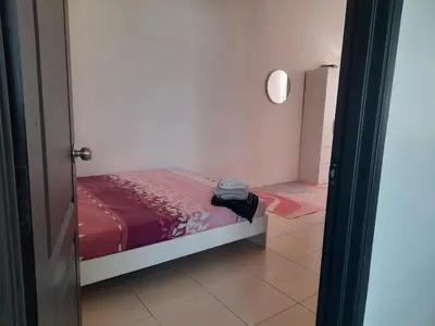 a small bedroom with a bed with a red blanket at D' Tronoh Home in Teronoh