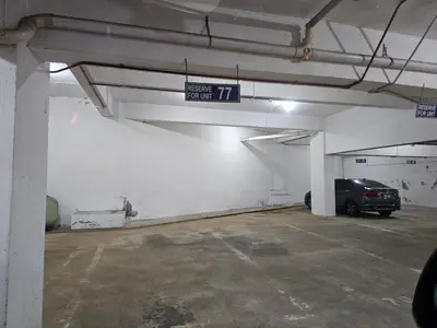 a parking garage with a car parked in it at Fukuda Minshuku Japanese style in Lumut