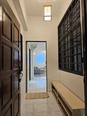 a hallway with a door leading to a living room at Fukuda Minshuku Japanese style in Lumut