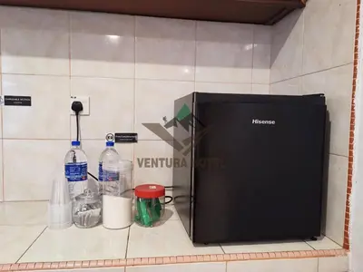 a machine sitting on a counter with bottles of water at Ventura Hotel and Tours in Gua Musang
