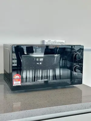 a toaster oven sitting on top of a counter at Urban Suites Georgetown by BNB4U in Jelutong