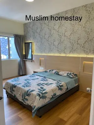 a bedroom with a bed in a room at Adik Aisyah classic 2 in Cameron Highlands