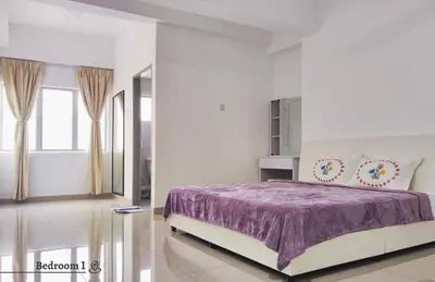 a white bedroom with a purple bed and a window at Time Homestay (6-8pax) The Venus, Manjung/Sitiawan in Sitiawan
