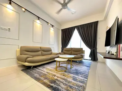a living room with a couch and a table at Ipoh Cozy Homestay by Comfort Home in Ipoh
