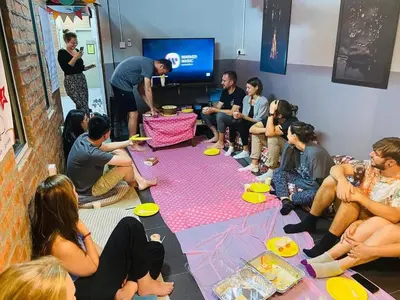 a group of people sitting around a room at BRICKS Backpackers Sleepbox in Tanah Rata