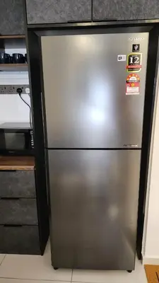 a stainless steel refrigerator in a kitchen next to a counter at Urbanite Premier Suite - Horizon Ipoh by Grab A Stay in Ipoh
