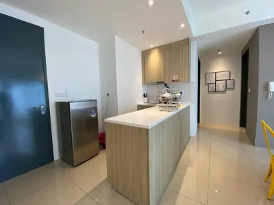 a kitchen with a counter and a refrigerator at Comfy Stay x 218 Macalister 2BR (Georgetown) \u4e54\u6cbb\u5e02\u4e2d\u5fc3 in George Town