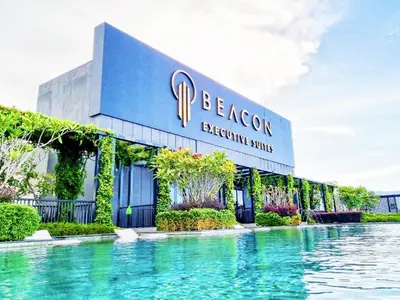 a resort with a swimming pool in front of a building at The Beacon Executive Penang Georgetown in George Town