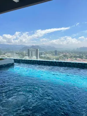a swimming pool with a view of a city at JOMSTAY - Horizon Suites Ipoh Town Skypool in Ipoh