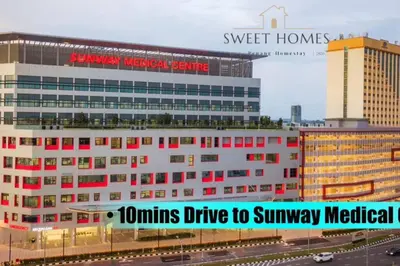 a large white building with red windows in a city at Catty Suite Prai • 3BR • 2Carparks@6mins PG Bridge in Perai
