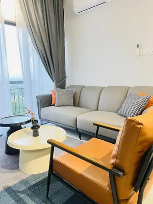 a living room with a couch and a table at The Horizon Ipoh By Iconique Espace in Ipoh