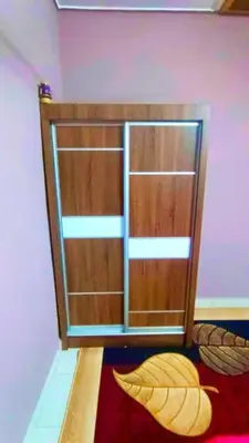 a room with a wooden door in a room at Homestay Rezeki Batu Gajah in Batu Gajah