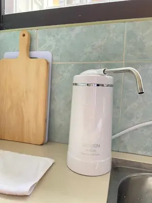 a tea kettle on a counter next to a sink at Unique 4 Bedrooms House, Few mins to Town by Mr Homestay in Teluk Intan