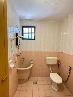 a bathroom with a toilet and a tub and a sink at Unique 4 Bedrooms House, Few mins to Town by Mr Homestay in Teluk Intan