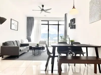 a living room with a table and chairs and a couch at Beacon Executive Suites #Minimalist #SkyPool #Georgetown #6pax #2BR 2bath #3 Queen #Quality well maintained #Private host in George Town