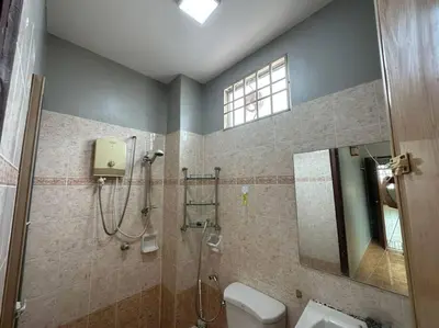 a bathroom with a shower and a toilet and a sink at Muslim Suite Home @ Airport Bayan Lepas Penang in Bayan Lepas