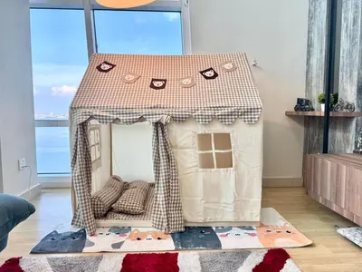 a small play house with a roof in a room at Maritime Suite #Full Seaview #Pool Table #Hot Water Dispenser #Kids friendly #Georgetown #6pax #2BR2bath #Private host in Jelutong