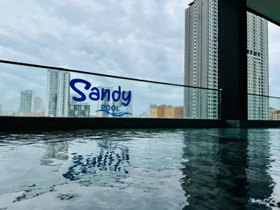 a sign on the side of a building next to the water at Urban Suite Cozy Family Homestay at Georgetown by URBAN STAYCATION HENG LOD LUXE in Jelutong