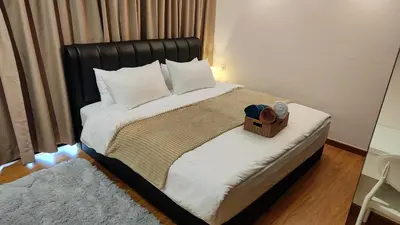 a bed with a black headboard and a wooden box on it at SkyPool 2BR 9pax Premium Suite@Beacon @Georgetown @Penang in George Town