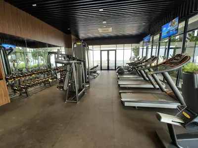 a gym with a row of treadmills and machines at SkyPool 2BR 9pax Premium Suite@Beacon @Georgetown @Penang in George Town