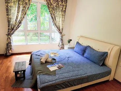 a bedroom with a bed with a teddy bear on it at IPOH All Suite Resort, Jalan Haven, Persiaran Lembah Perpaduan, Ipoh in Ipoh