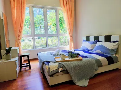 a bedroom with a bed and a large window at IPOH All Suite Resort, Jalan Haven, Persiaran Lembah Perpaduan, Ipoh in Ipoh