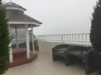 a gazebo and a bench on a patio at Cameron Highlands, The Breeze @ Barrington Square in Brinchang