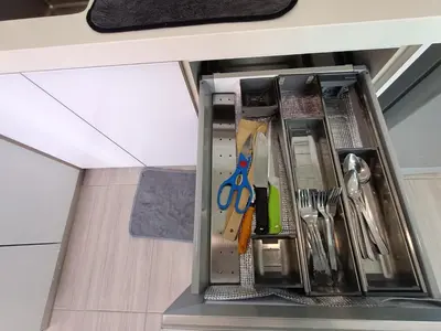 a drawer in a kitchen with utensils at Awesome Suites 1, Netflix, Georgetown in Jelutong